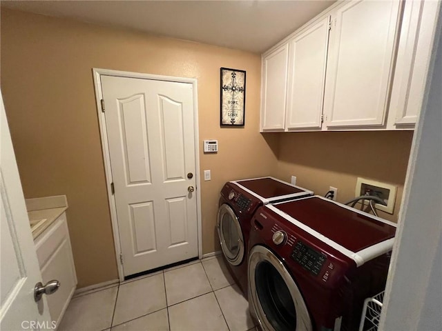 12413 Redrock Rd, Victorville, CA 92392 - laundry area featuring cabinet space, washing machine and clothes dryer, light tile patterned flooring, and baseboards