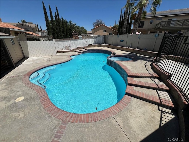 12413 Redrock Rd, Victorville, CA 92392 - view of swimming pool with a patio, a fenced backyard, and a pool with connected hot tub