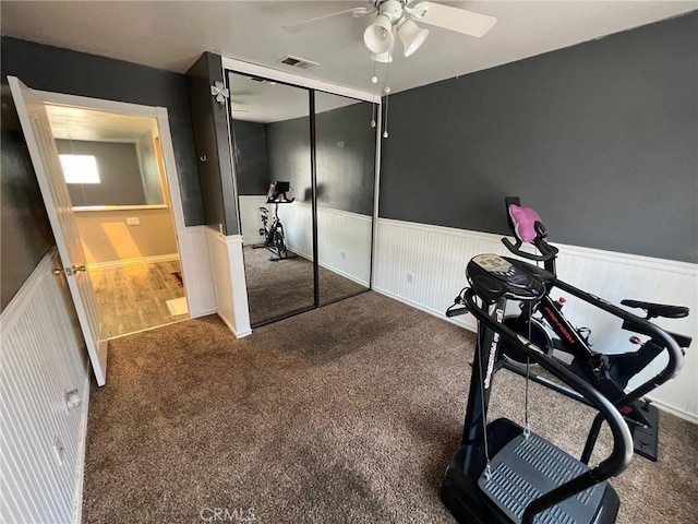 12413 Redrock Rd, Victorville, CA 92392 - exercise area with a ceiling fan, a wainscoted wall, and carpet floors