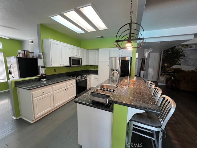 12413 Redrock Rd, Victorville, CA 92392 - kitchen with stainless steel appliances, a sink, white cabinetry, and dark wood-style floors