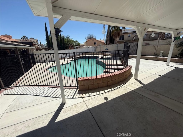12413 Redrock Rd, Victorville, CA 92392 - view of pool featuring a patio area, a fenced backyard, and a pool with connected hot tub