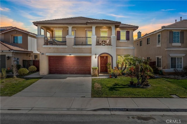 37814 Veranda Way, Murrieta, CA 92563 - mediterranean / spanish house featuring a balcony, stucco siding, a garage, and a yard