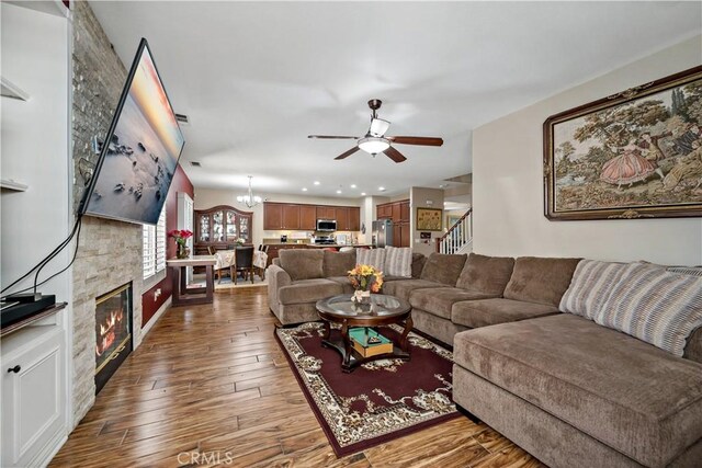 37814 Veranda Way, Murrieta, CA 92563 - living area with ceiling fan, dark wood-type flooring, recessed lighting, stairway, and a chandelier