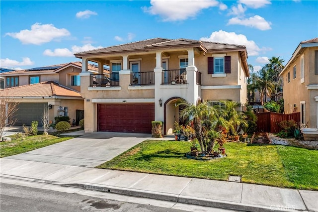 37814 Veranda Way, Murrieta, CA 92563 - view of front of home with stucco siding, a balcony, an attached garage, concrete driveway, and a tiled roof