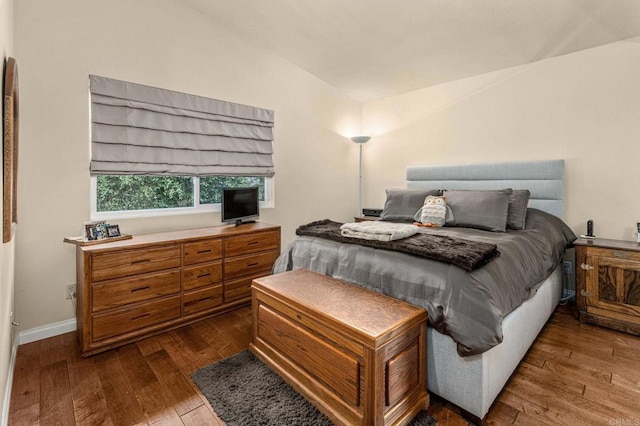 4243 Corte De La Siena, San Diego, CA 92130 - bedroom featuring lofted ceiling, dark wood-style flooring, and baseboards