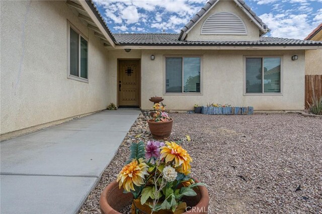 14752 Grafton Ln, Helendale, CA 92342 - doorway to property with stucco siding