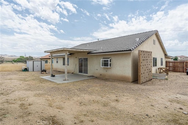 14752 Grafton Ln, Helendale, CA 92342 - rear view of house with a patio, stucco siding, and a tiled roof