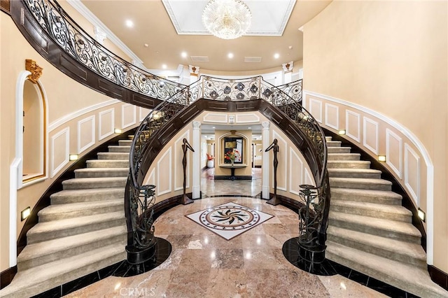 1539 Rodeo Rd, Arcadia, CA 91006 - foyer entrance with stairs, inlaid floor details, marble tiled flooring, a towering ceiling, and ornamental molding