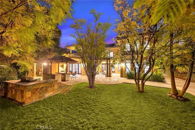 1539 Rodeo Rd, Arcadia, CA 91006 - view of front facade featuring an outdoor kitchen, a lawn, a patio, and french doors