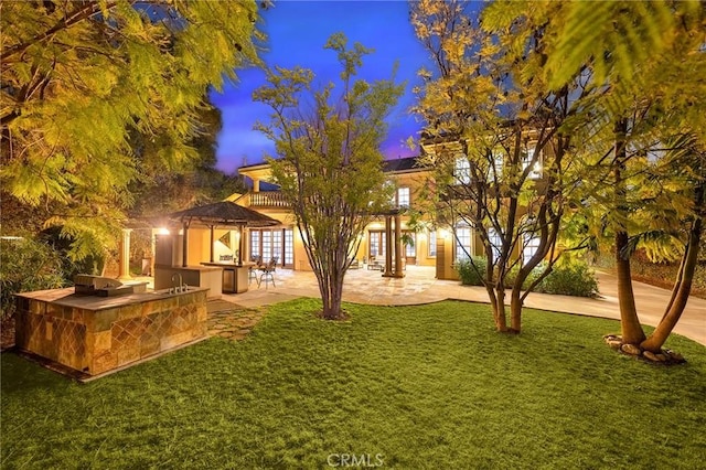 1539 Rodeo Rd, Arcadia, CA 91006 - view of front of house with an outdoor kitchen, a lawn, a patio area, and french doors