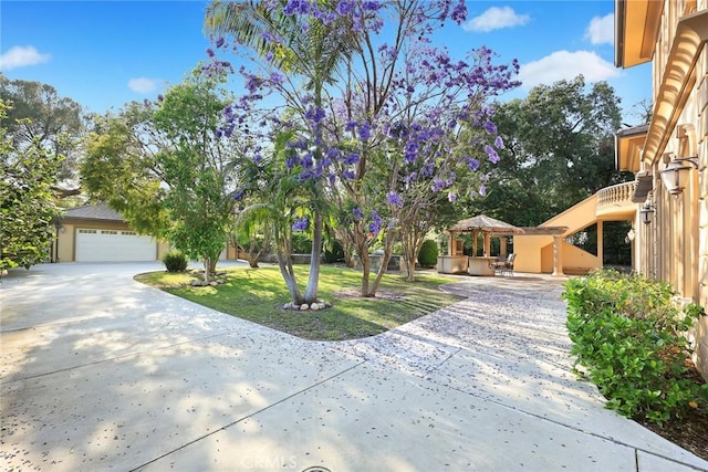 1539 Rodeo Rd, Arcadia, CA 91006 - view of front facade with a gazebo, driveway, a garage, stucco siding, and a front lawn