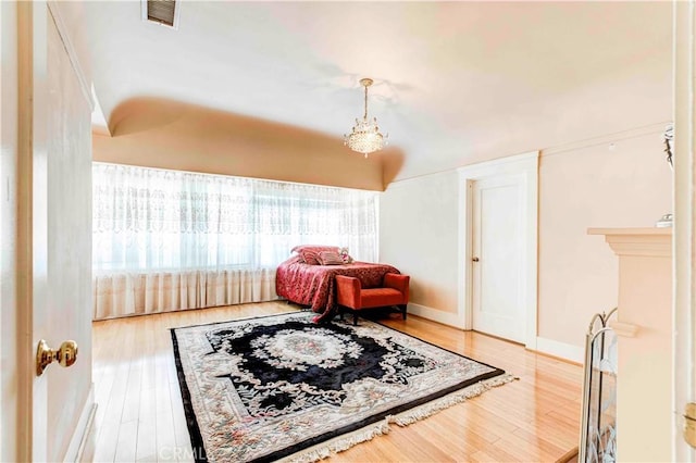 1610 N Hobart Blvd, Los Angeles, CA 90027 - sitting room featuring wood finished floors, a chandelier, and baseboards