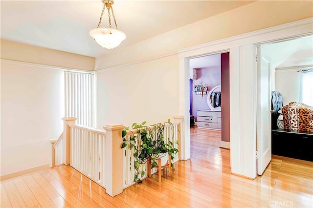 1610 N Hobart Blvd, Los Angeles, CA 90027 - hall featuring light wood finished floors and an upstairs landing