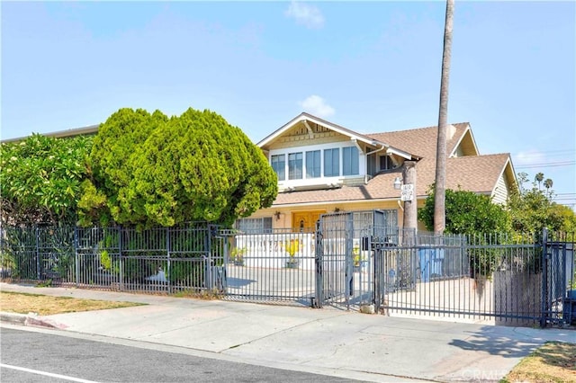 1610 N Hobart Blvd, Los Angeles, CA 90027 - view of front of house with a fenced front yard, a shingled roof, and a gate