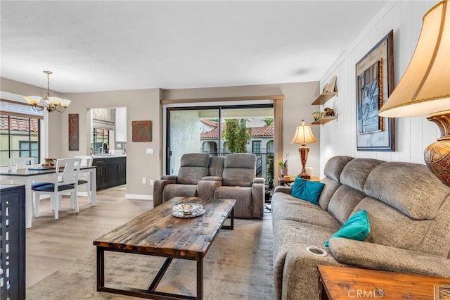 13219 Wimberly Sq Unit 306, San Diego, CA 92128 - living area featuring a chandelier and light wood finished floors