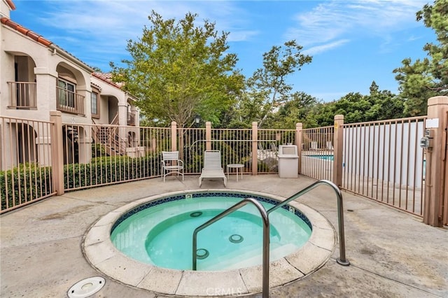 13219 Wimberly Sq Unit 306, San Diego, CA 92128 - view of pool featuring a community hot tub and a patio