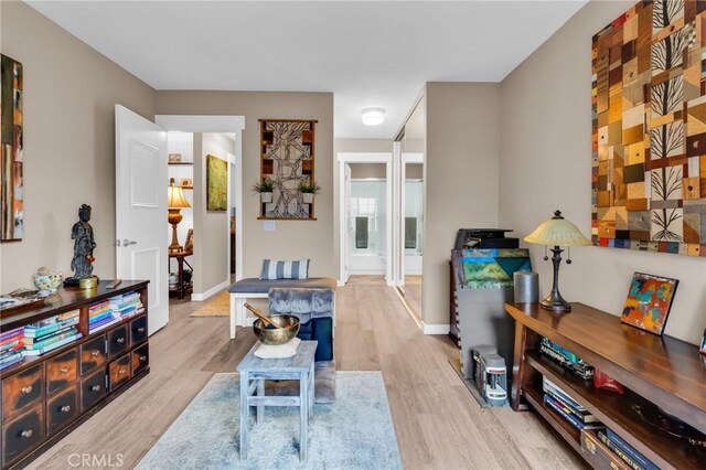 13219 Wimberly Sq Unit 306, San Diego, CA 92128 - living room featuring wood finished floors and baseboards