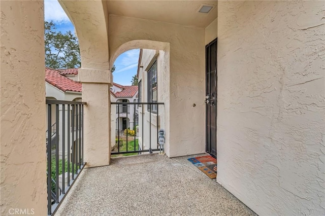 13219 Wimberly Sq Unit 306, San Diego, CA 92128 - view of exterior entry featuring stucco siding and a balcony