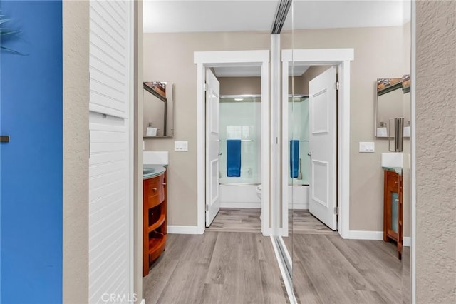 13219 Wimberly Sq Unit 306, San Diego, CA 92128 - hall featuring light wood-style floors and baseboards
