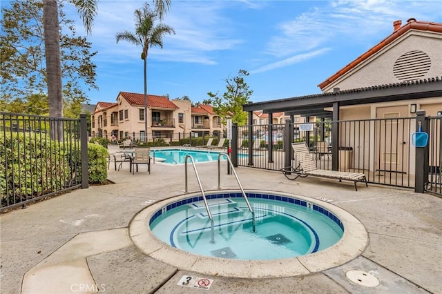 13219 Wimberly Sq Unit 306, San Diego, CA 92128 - community pool with a hot tub and a patio
