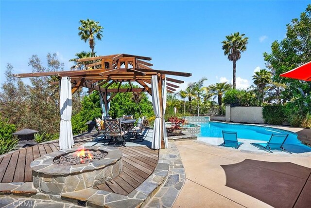 27121 Shenandoah Dr, Laguna Hills, CA 92653 - view of swimming pool with an outdoor fire pit, a patio, a pergola, and outdoor dining area