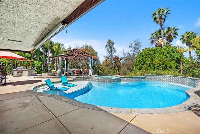 27121 Shenandoah Dr, Laguna Hills, CA 92653 - view of pool with a gazebo, exterior kitchen, a patio, and a pool with connected hot tub