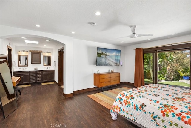 27121 Shenandoah Dr, Laguna Hills, CA 92653 - bedroom featuring dark wood finished floors, connected bathroom, arched walkways, access to outside, and recessed lighting