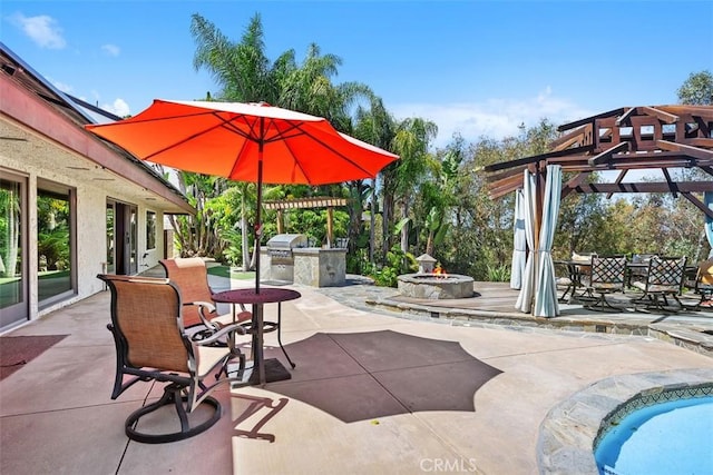 27121 Shenandoah Dr, Laguna Hills, CA 92653 - view of patio / terrace featuring an outdoor kitchen, a pergola, outdoor dining area, and a fire pit