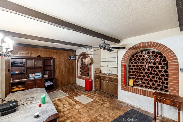 1849 Ayers Way, Burbank, CA 91501 - wine cellar with wood walls, ceiling fan, a textured ceiling, beam ceiling, and a sink