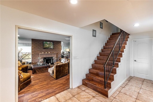 1849 Ayers Way, Burbank, CA 91501 - staircase with tile patterned flooring, a brick fireplace, recessed lighting, and baseboards