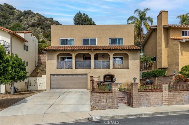 1849 Ayers Way, Burbank, CA 91501 - mediterranean / spanish home featuring stucco siding, an attached garage, concrete driveway, and a tile roof