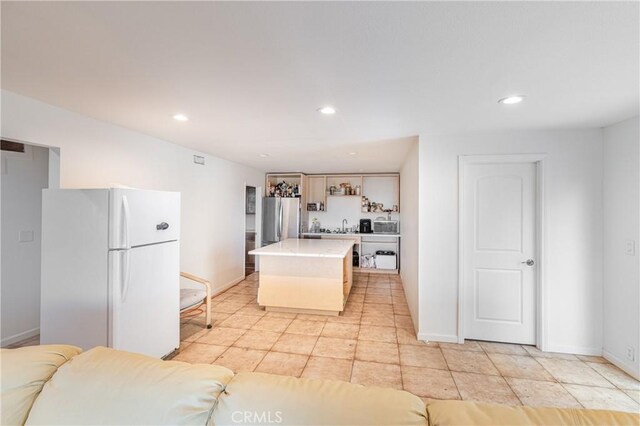 1849 Ayers Way, Burbank, CA 91501 - kitchen featuring freestanding refrigerator, a center island, light countertops, recessed lighting, and baseboards