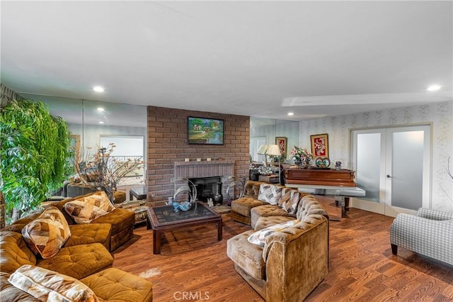 1849 Ayers Way, Burbank, CA 91501 - living room with wood finished floors, a brick fireplace, wallpapered walls, french doors, and recessed lighting