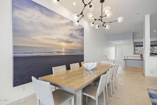 815 Mandalay Beach Rd, Oxnard, CA 93035 - dining room with a water view, a chandelier, light tile patterned floors, baseboards, and recessed lighting