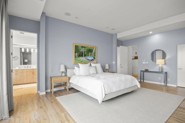 815 Mandalay Beach Rd, Oxnard, CA 93035 - bedroom featuring light wood-style floors, a sink, baseboards, and ensuite bathroom