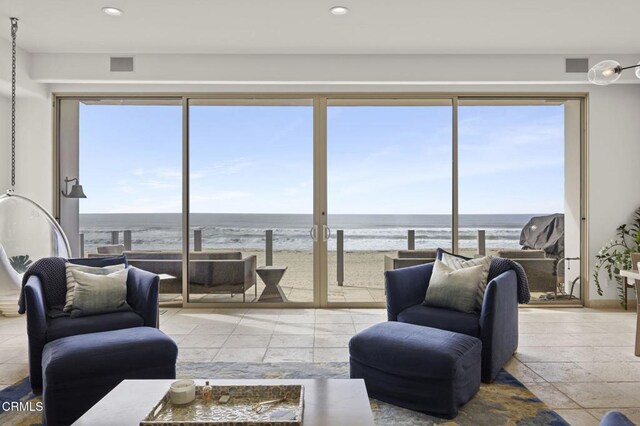 815 Mandalay Beach Rd, Oxnard, CA 93035 - living area featuring a water view, recessed lighting, and stone tile flooring