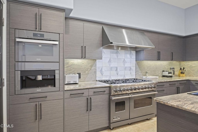 815 Mandalay Beach Rd, Oxnard, CA 93035 - kitchen with stainless steel appliances, wall chimney exhaust hood, tasteful backsplash, and modern cabinets