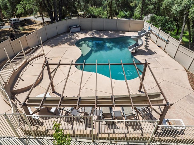 51793 Quail Ridge Rd, Oakhurst, CA 93644 - view of pool with a water slide, view of wooded area, and a patio