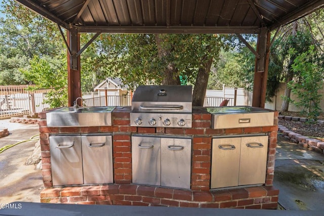 51793 Quail Ridge Rd, Oakhurst, CA 93644 - fenced backyard featuring a gazebo, a sink, and a patio area