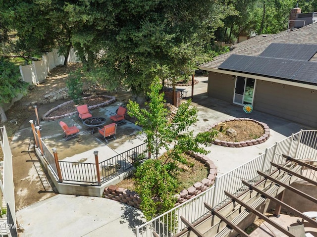 51793 Quail Ridge Rd, Oakhurst, CA 93644 - fenced backyard featuring a patio area, an outdoor fire pit, and stairs