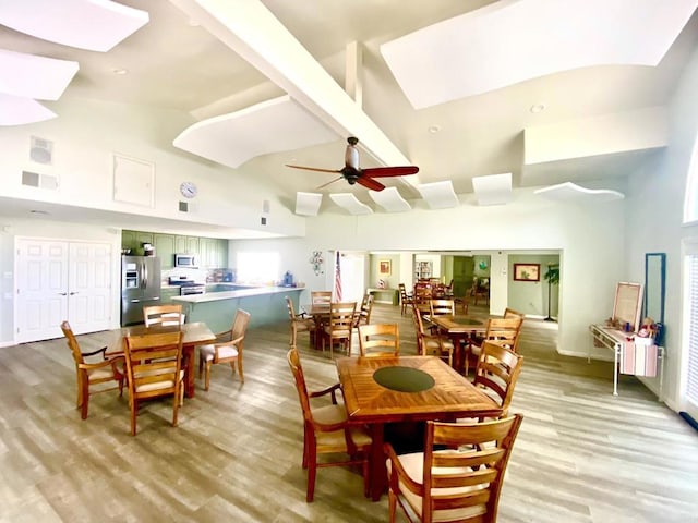 3372 Corsica Way, Oceanside, CA 92056 - dining room featuring a skylight, high vaulted ceiling, light wood-style flooring, and ceiling fan