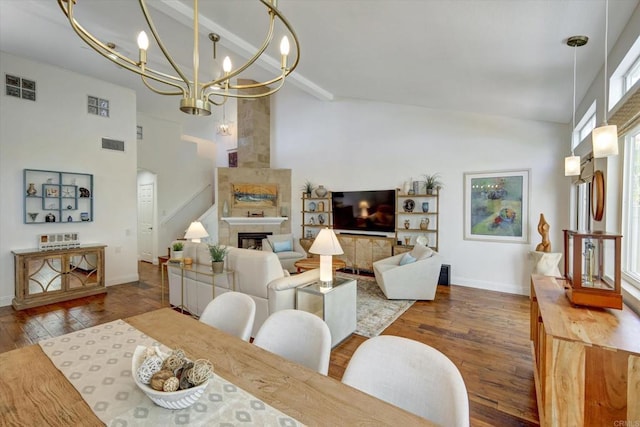 3372 Corsica Way, Oceanside, CA 92056 - dining area featuring high vaulted ceiling, a chandelier, wood finished floors, and a tile fireplace
