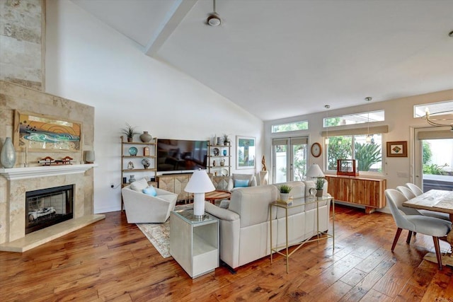 3372 Corsica Way, Oceanside, CA 92056 - living room with high vaulted ceiling, hardwood / wood-style flooring, and a high end fireplace