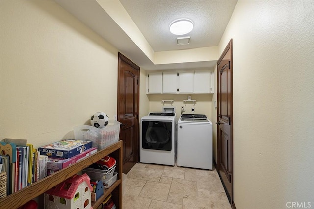 469 Grinnel Ct, Simi Valley, CA 93065 - washroom with cabinet space, washer and dryer, light stone finish floors, and a textured ceiling