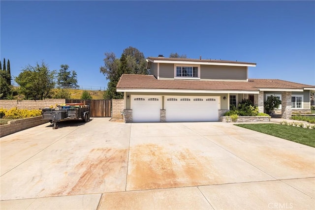 469 Grinnel Ct, Simi Valley, CA 93065 - view of front of home with driveway, stone siding, and a garage