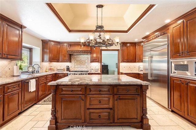 469 Grinnel Ct, Simi Valley, CA 93065 - kitchen with built in appliances, a center island, a raised ceiling, premium range hood, and recessed lighting