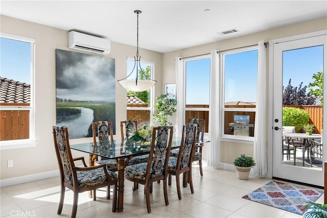 905 Romneya Ln, Santa Maria, CA 93455 - dining area with an AC wall unit, baseboards, and light tile patterned flooring