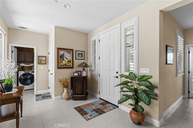 905 Romneya Ln, Santa Maria, CA 93455 - entryway featuring washer / clothes dryer, healthy amount of natural light, baseboards, and tile patterned floors