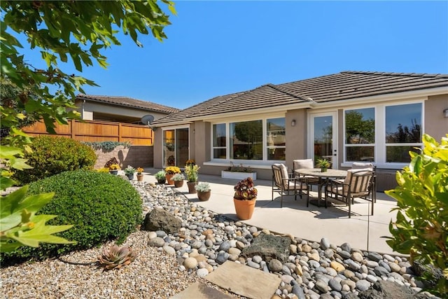 905 Romneya Ln, Santa Maria, CA 93455 - back of house with a patio, a tiled roof, and stucco siding
