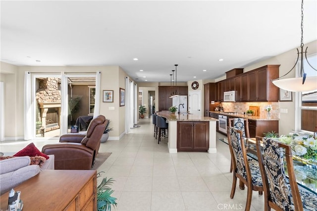905 Romneya Ln, Santa Maria, CA 93455 - living room with light tile patterned flooring, recessed lighting, baseboards, and plenty of natural light